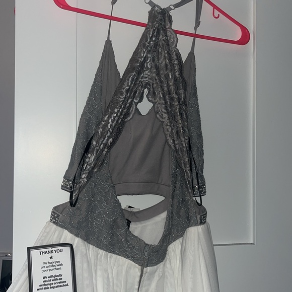 White skirt. sparkly mid section, with gray top. Cut outs w/ pearls and sparkles - Picture 2 of 4